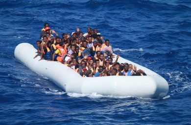 Illegal migrants aboard an inflatable vessel.
Obtained from https://www.flickr.com/photos/cne-cna-c6f/28613893796 (Public domain: copyright and credit free)
160729-N-EU999-004 MEDITERRANEAN SEA (July 29, 2016) Migrants aboard an inflatable vessel approach the guided-missile destroyer USS Carney (DDG 64). Carney provided food and water to the migrants aboard the vessel before coordinating with a nearby merchant vessel to take them to safety. Carney is forward deployed to Rota, Spain, and is conducting a routine patrol in the U.S. 6th Fleet area of operations in support of U.S. national security interests in Europe. (U.S. navy photo by Chief Information Systems Technician Wesley R. Dickey/Released)
